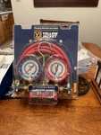 Yellow Jacket 42007 Charging Manifold And Hoses. Fixed Price $100.00.